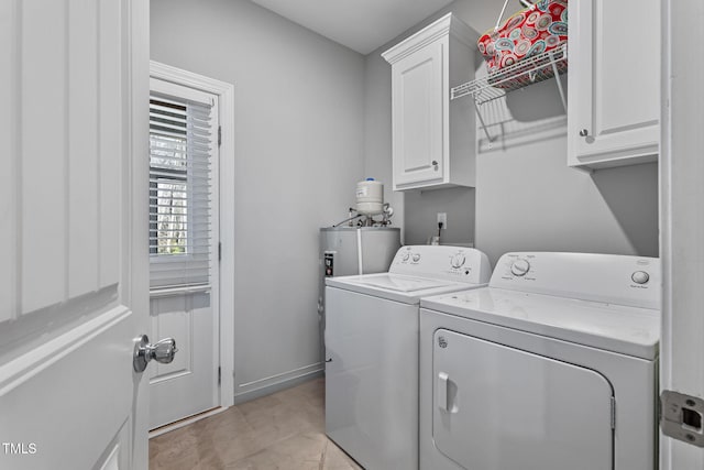 washroom with independent washer and dryer and cabinets