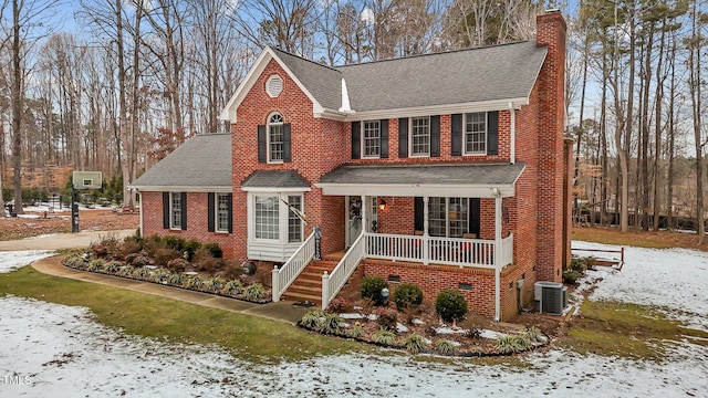 view of front facade featuring covered porch and central AC