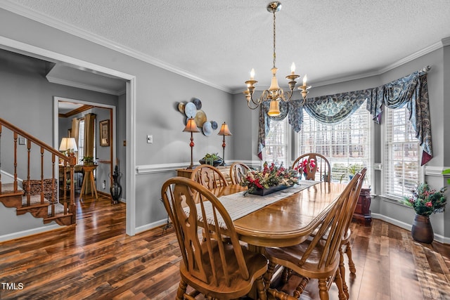 dining area with a textured ceiling, dark hardwood / wood-style floors, ornamental molding, and a notable chandelier