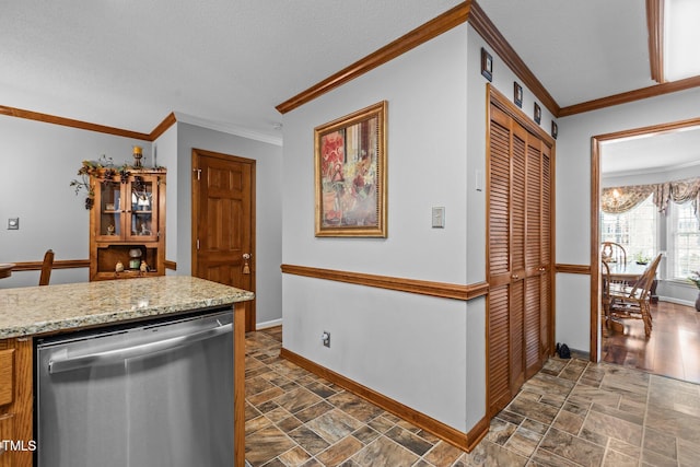 kitchen featuring light stone counters, a textured ceiling, dishwasher, and ornamental molding