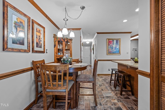 dining room featuring an inviting chandelier and ornamental molding