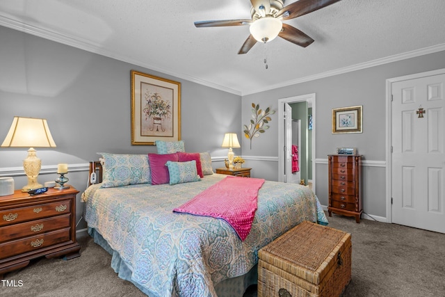 carpeted bedroom with ceiling fan, a textured ceiling, and crown molding