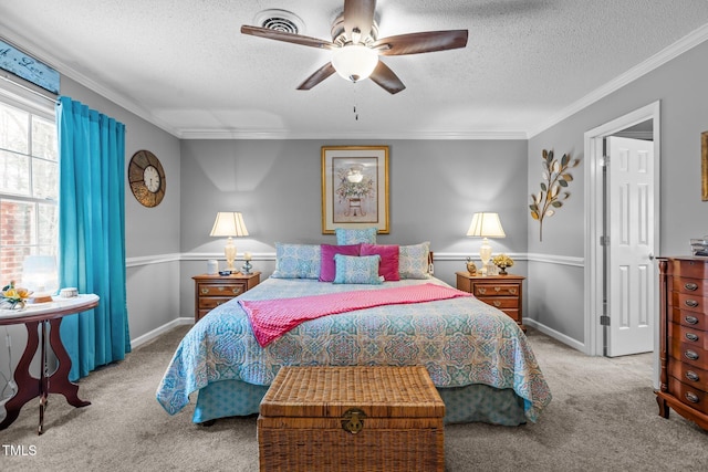 carpeted bedroom with ceiling fan, a textured ceiling, and ornamental molding