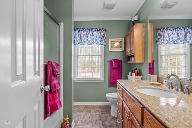 bathroom with vanity, toilet, crown molding, and walk in shower