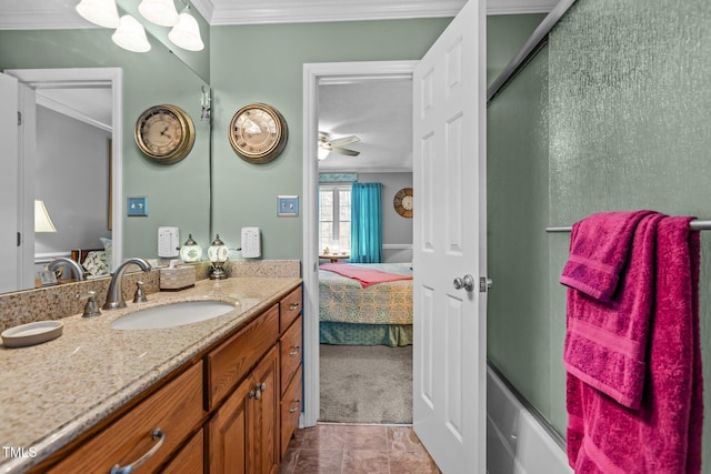 bathroom with ceiling fan, ornamental molding, and tile patterned floors