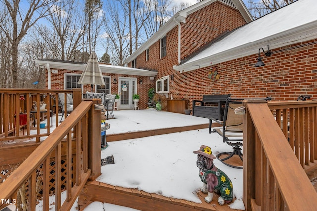 view of snow covered deck