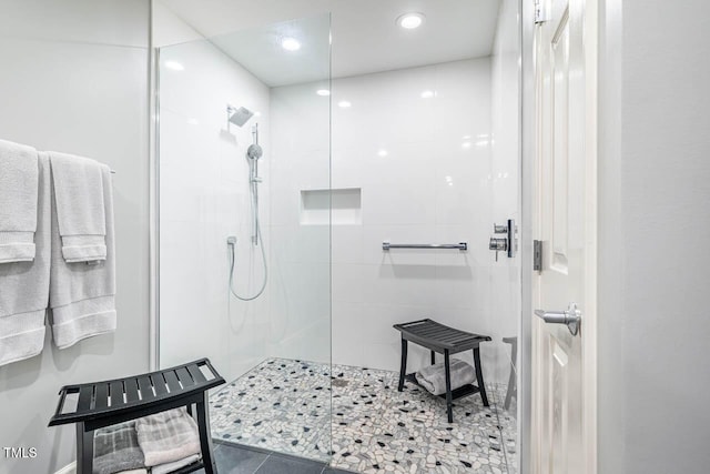 bathroom with tiled shower