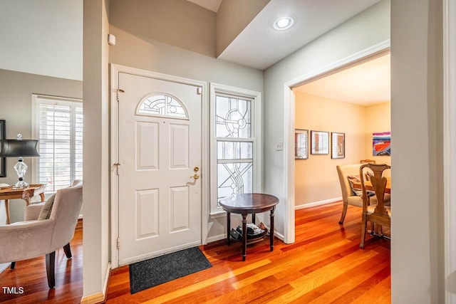 entryway with hardwood / wood-style floors