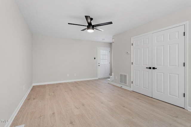 unfurnished room with ceiling fan and light wood-type flooring