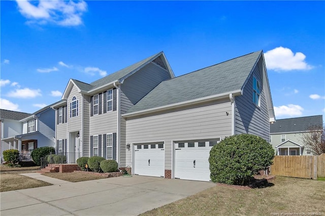 view of front of property with a front lawn and a garage