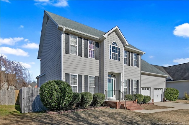 colonial inspired home featuring a garage