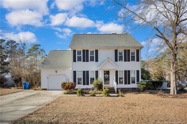 colonial inspired home featuring a garage