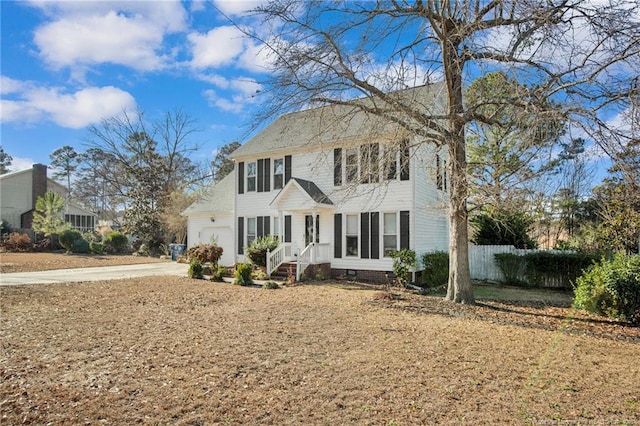 colonial home with a garage