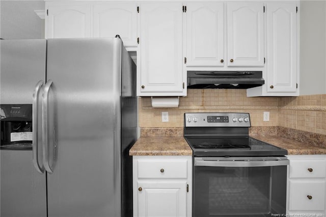 kitchen with white cabinets, stainless steel appliances, and tasteful backsplash