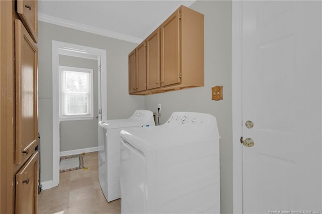 clothes washing area with light tile patterned floors, cabinets, washer and dryer, and ornamental molding