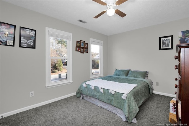 bedroom with ceiling fan and carpet