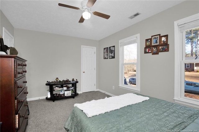 bedroom with ceiling fan and carpet floors