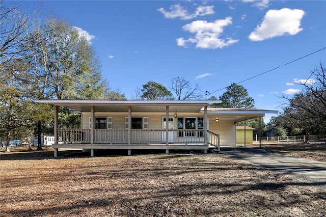 view of front of home with a carport