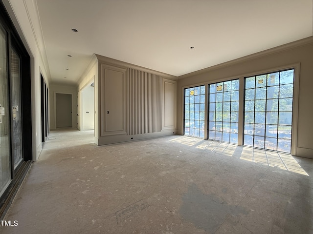 unfurnished room with ornamental molding