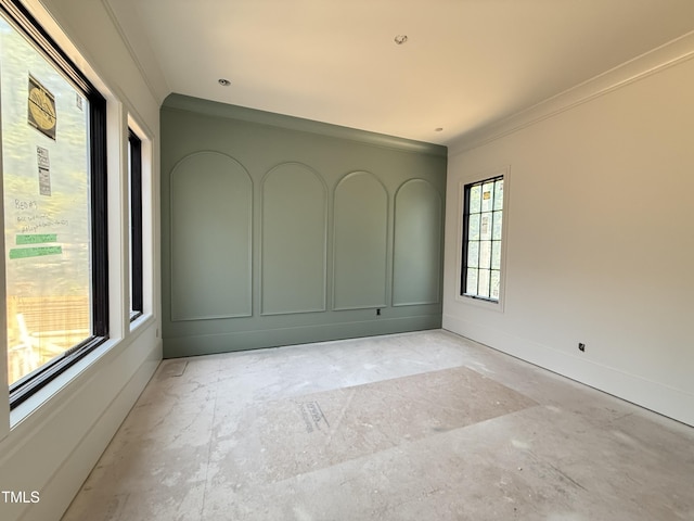empty room with baseboards and ornamental molding