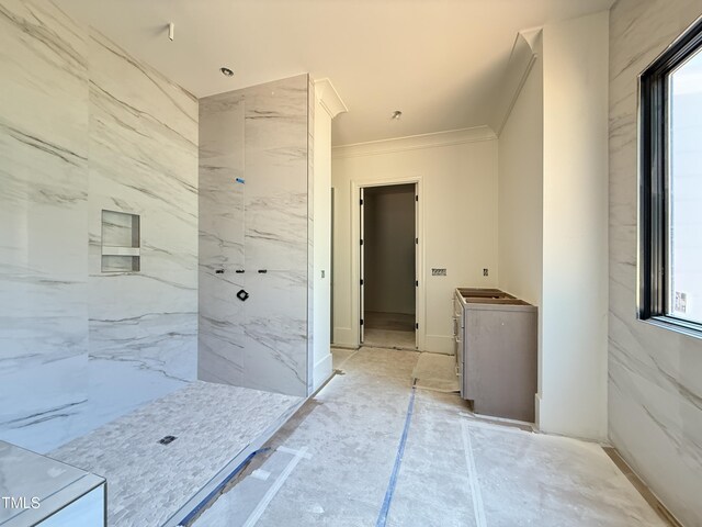 bathroom featuring a healthy amount of sunlight, crown molding, and walk in shower