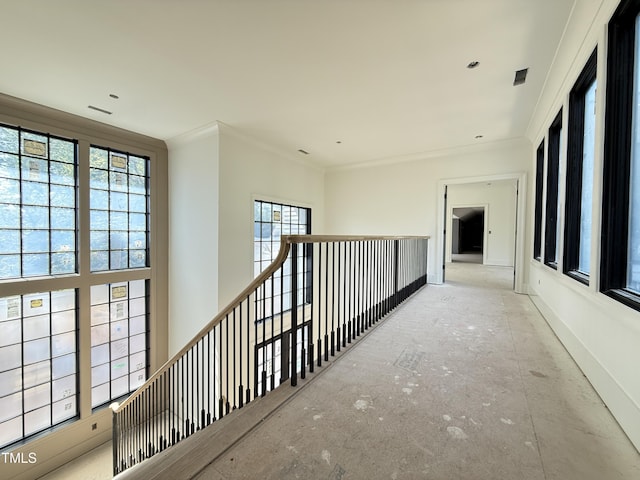 hall with crown molding and baseboards