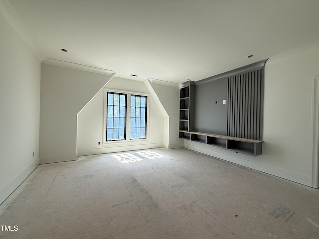 interior space featuring crown molding and baseboards