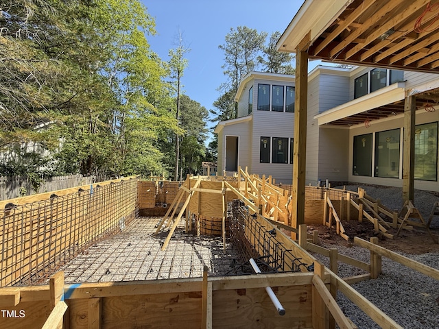 exterior space featuring fence and stairs