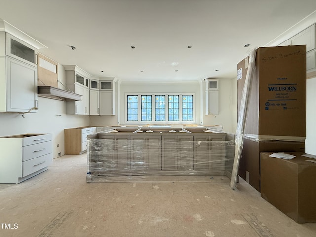 kitchen featuring glass insert cabinets and white cabinets