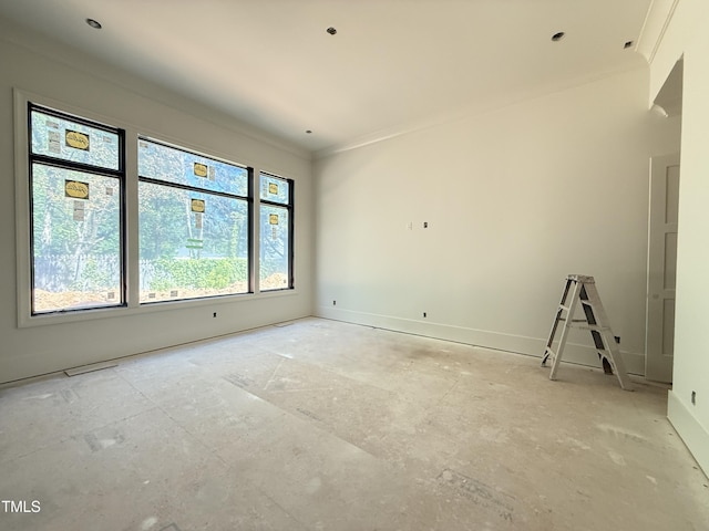 unfurnished room featuring baseboards and ornamental molding