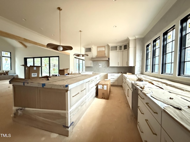 7013 Buckhead Dr, Raleigh, NC 27615 - kitchen with open floor plan, white cabinetry, decorative backsplash, hanging light fixtures, and glass insert cabinets