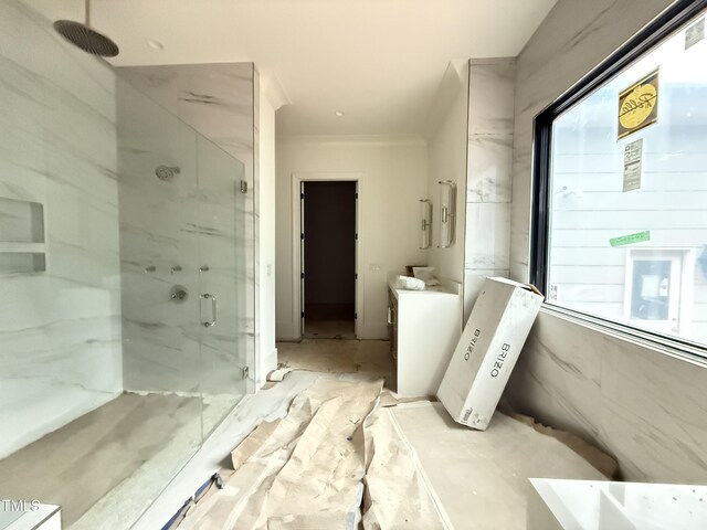 7013 Buckhead Dr, Raleigh, NC 27615 - full bathroom with a marble finish shower, vanity, plenty of natural light, and ornamental molding
