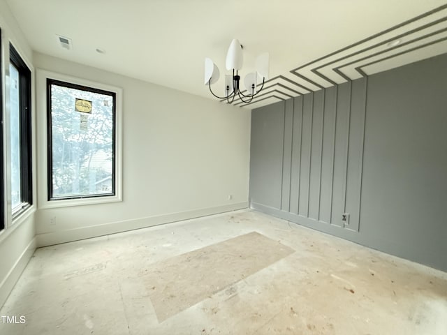 7013 Buckhead Dr, Raleigh, NC 27615 - empty room with a chandelier