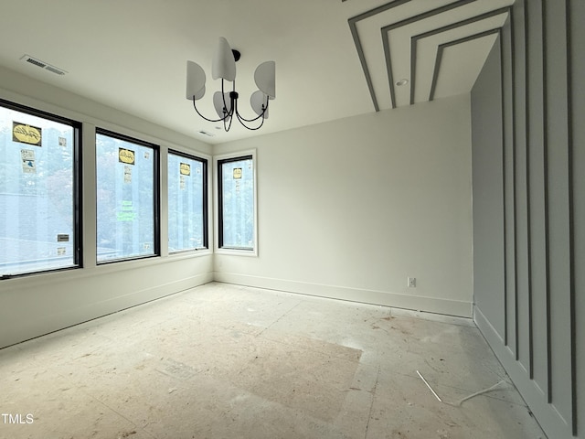 7013 Buckhead Dr, Raleigh, NC 27615 - unfurnished room featuring healthy amount of natural light, a chandelier, and baseboards