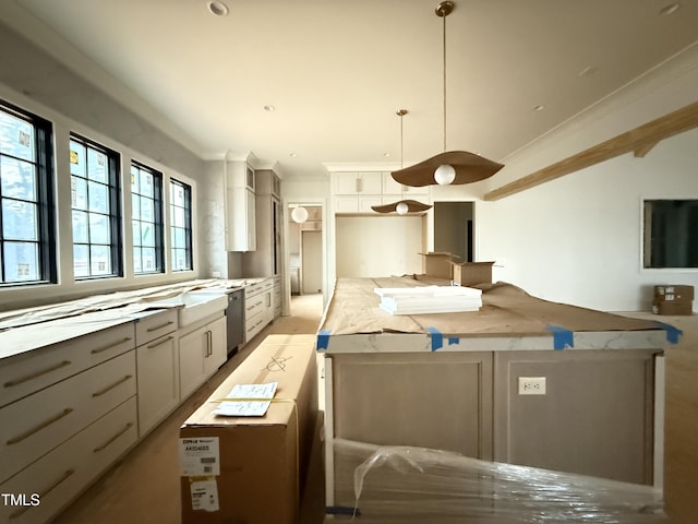 7013 Buckhead Dr, Raleigh, NC 27615 - kitchen featuring ornamental molding, white cabinetry, stainless steel dishwasher, light countertops, and decorative light fixtures
