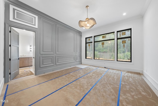7013 Buckhead Dr, Raleigh, NC 27615 - empty room featuring crown molding and a decorative wall