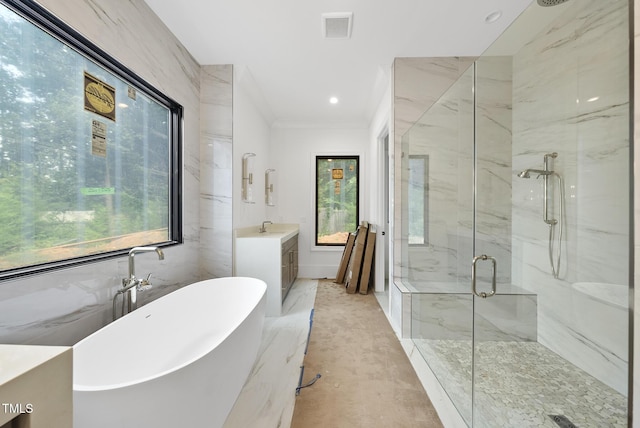 7013 Buckhead Dr, Raleigh, NC 27615 - full bath featuring vanity, a marble finish shower, a freestanding bath, and ornamental molding