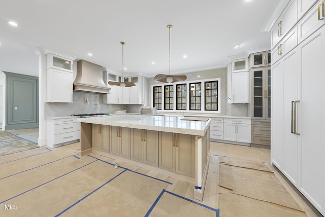7013 Buckhead Dr, Raleigh, NC 27615 - kitchen with premium range hood, tasteful backsplash, a center island, white cabinetry, and recessed lighting