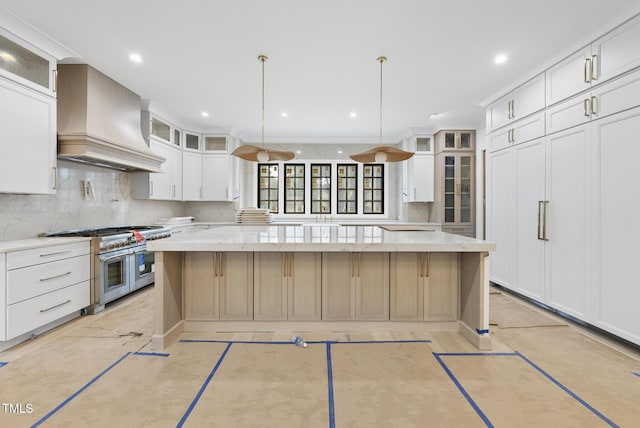 7013 Buckhead Dr, Raleigh, NC 27615 - kitchen with double oven range, custom range hood, a spacious island, tasteful backsplash, and white cabinetry