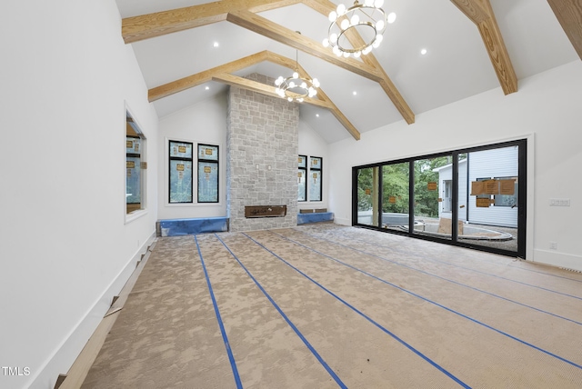 7013 Buckhead Dr, Raleigh, NC 27615 - unfurnished living room featuring a chandelier, high vaulted ceiling, beamed ceiling, recessed lighting, and a stone fireplace