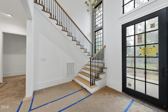 7013 Buckhead Dr, Raleigh, NC 27615 - entryway featuring stairs, a chandelier, and a high ceiling