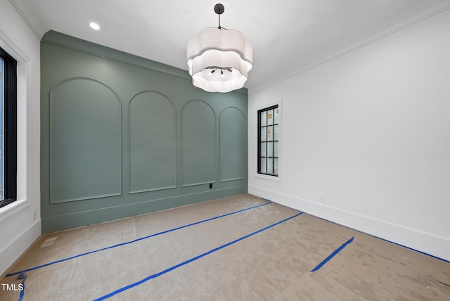7013 Buckhead Dr, Raleigh, NC 27615 - unfurnished room with crown molding, plenty of natural light, recessed lighting, carpet floors, and a chandelier