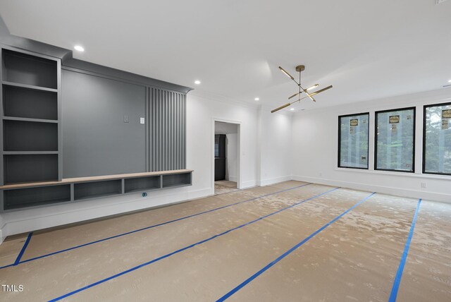 7013 Buckhead Dr, Raleigh, NC 27615 - unfurnished living room featuring crown molding, a chandelier, and recessed lighting