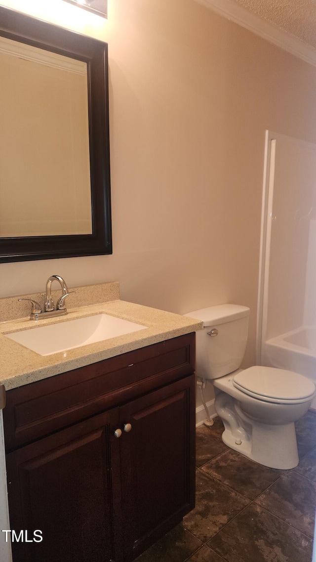 bathroom featuring vanity, ornamental molding, a textured ceiling, and toilet