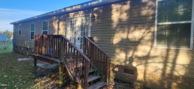 entrance to property with a wooden deck