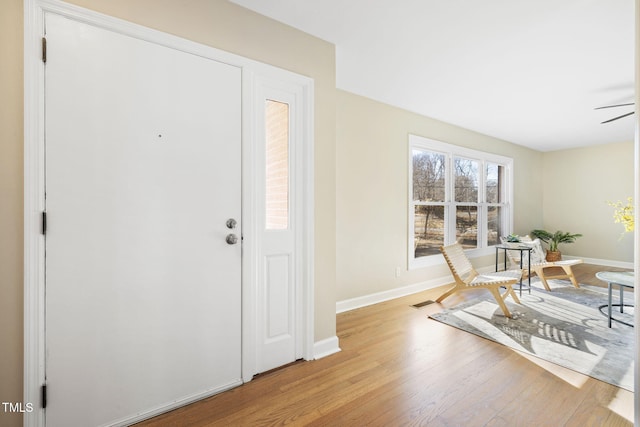 foyer featuring light hardwood / wood-style floors and ceiling fan