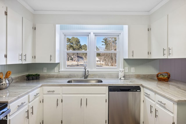 kitchen with stainless steel dishwasher, white cabinets, sink, and ornamental molding