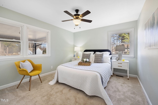 bedroom featuring ceiling fan and light carpet