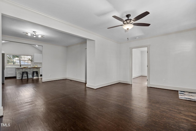 unfurnished room with ceiling fan, dark hardwood / wood-style flooring, and ornamental molding