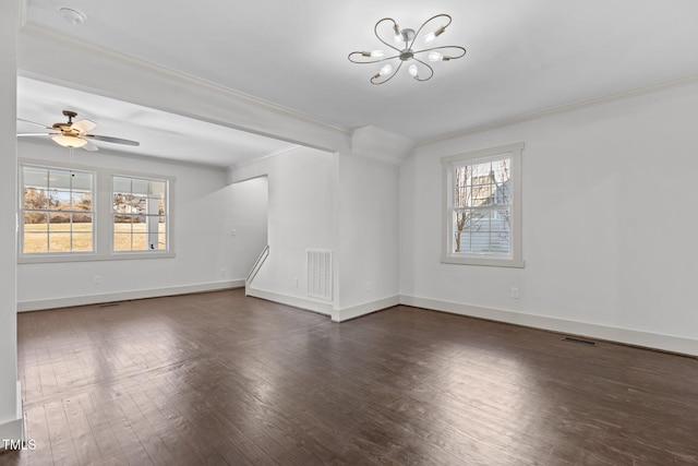 unfurnished living room with dark wood-type flooring, ceiling fan with notable chandelier, and ornamental molding